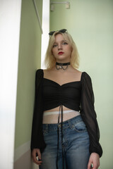 Studio portrait of a young beautiful blonde long-haired girl.