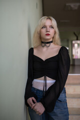 Studio portrait of a young beautiful blonde long-haired girl.