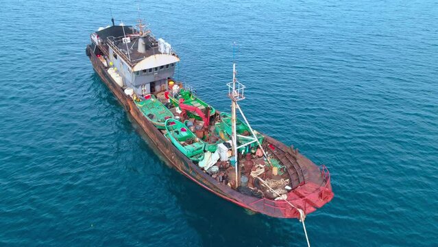 Aerial shot of illegal Chinese fishing vessel at anchor, apprehended after being caught fishing inside Palau's National Marine Sanctuary.