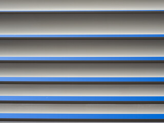 Obraz premium Horizontal sunshades or bioclimatic pergolas. A structure with adjustable slat roofing system. A protection from the sun. Aluminium pergola