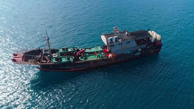 Aerial shot of illegal Chinese fishing vessel at anchor, apprehended after being caught fishing inside Palau's National Marine Sanctuary.