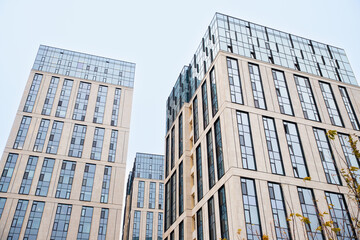 Fototapeta premium Blue beige walls apartment building. Tile and glass
