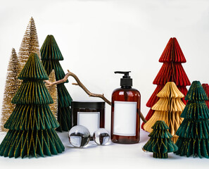 dark jar with lid and dispenser on the background of Christmas decorations, side view