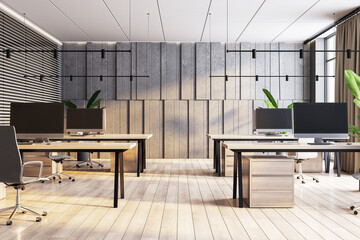 Modern office with herringbone wood flooring, textured concrete wall, and sleek workstations. 3D Rendering