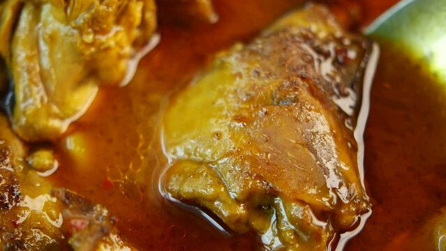 Chicken curry or masala in a bowl on table 