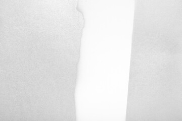 Silver spray paint on white background. Pattern shaped like torn paper. Copy space.