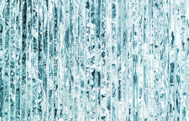Glass texture. Layers of glass. Window industry. Crystal shiny glass material. Artistic closeup. Blue color ice look design. Cold block of glass.