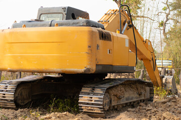 Rear view of a backhoe parked to take a break from work.