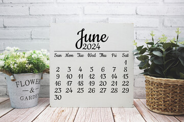 June 2024 monthly calendar on chalkboard for planning and management