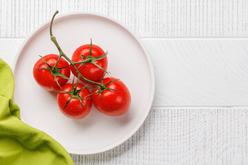 Fresh tomatoes on plate