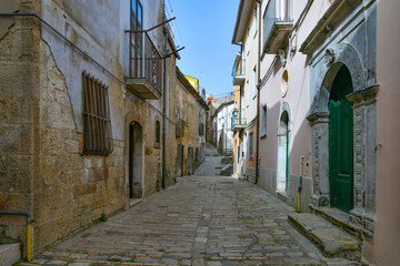 A street among the old houses of Macchia Valfortore, a medieval village in Molise, Italy.