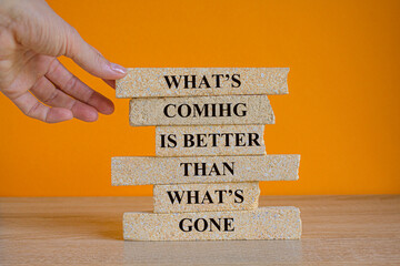 Motivational positive quote What is coming is better than what is gone written on brick blocks....