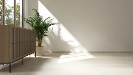 Empty room with white wall, wooden cabinet, plant in sunlight from window, tree shadow on wood...