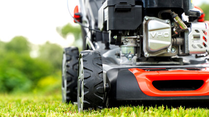 lawn mower on a mowed smooth green lawn