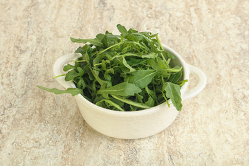 Fresh green arugula in the bowl