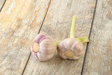 Two Young garlic over background