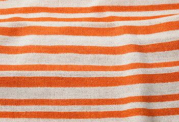 Orange white striped natural cotton linen textile texture background blank empty pattern with copy space for product design or text copyspace mock-up