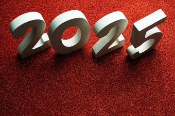 2025 Happy New Year with space copy on red glitter background