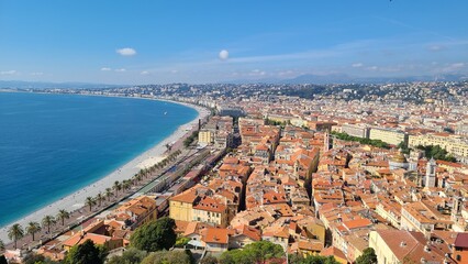 The city's red roofs and blue sky