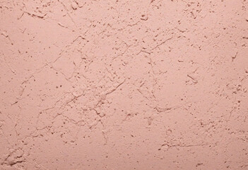 Peach pale pink colored low contrast concrete textured background with roughness and irregularities pattern with copy space for product