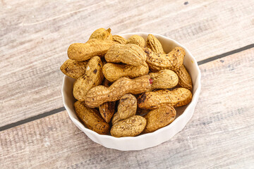 Raw ripe unpeeled peanut heap