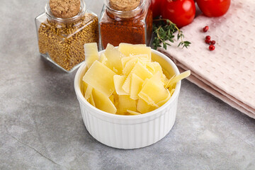 Sliced parmesan cheese in the bowl