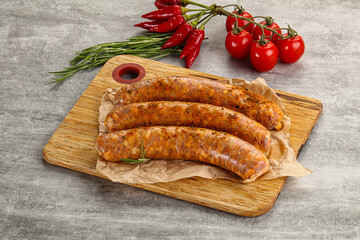 Raw sausages with spices and herbs