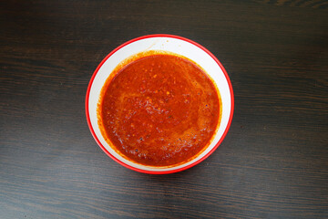 Spicy Chili Sauce Served in a Rustic Ceramic Bowl