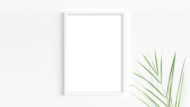 A video mockup of a white vertical A4 frame on a light background with a swaying palm leaf in the foreground