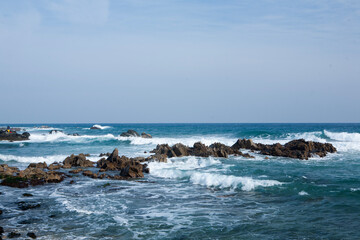 View of the surf on the rocky seaside