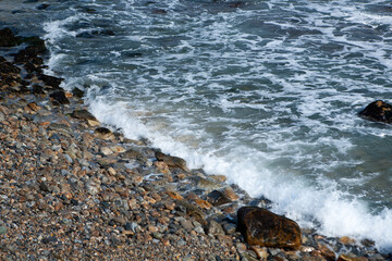 View of the surf on the rocky seaside