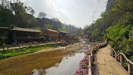 Small river and traditional houses at Cat Cat village, Sapa town, Vietnam in the afternoon.