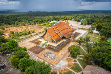 The aerial top view of Wat Sirindhorn Wararam or Wat Phu Prao, also known as the Glow Temple, is located in Sirindhorn, Ubon Ratchathani