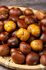 close up of peeled roasted chestnut on table.