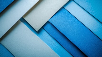 abstract background made of colored sheets of paper in blue tone. overlapping elements.