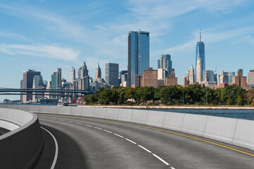 Empty urban asphalt road exterior with city buildings background. New modern highway concrete construction. Concept of way to success. Transportation logistic industry fast delivery. New York. USA.