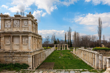 The Sebasteion, a grand structure adorned with detailed reliefs, stands alongside a long colonnade...