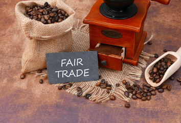 Fair trade coffee. Coffee grinder with ground coffee and coffee beans.