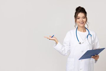 Attractive young girl in a doctor's gown with a stethoscope