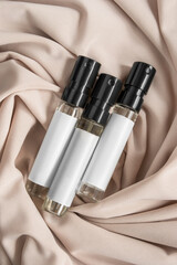 Perfumes on draped fabric