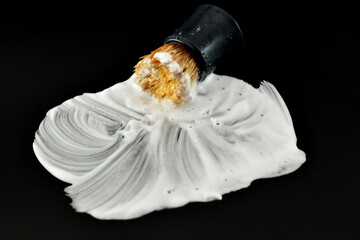 Shaving foam and shaving brush.