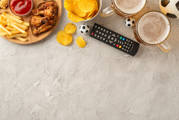 Soccer championship concept. Top view photo of stadium-favorite snacks: nachos, fried chicken,...