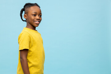 African american boy in yellow shirt looking excited
