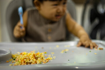 little Child Playing With Food On The Table