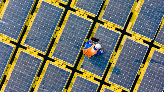 Aerial view floating solar cell power plant with solar cell generate the electric on the lake, Floating solar panels and cell platform on the water ecological energy, Alternative renewable energy.