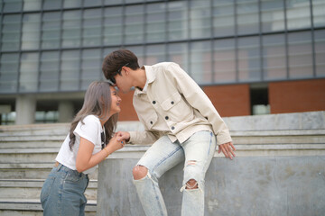 Beautiful young couple outdoors in the park. Portraits of lovers. Autumn. Spring. Holiday Valentine's Day.