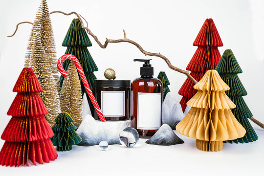 dark jar with lid and dispenser on the background of Christmas decorations, side view