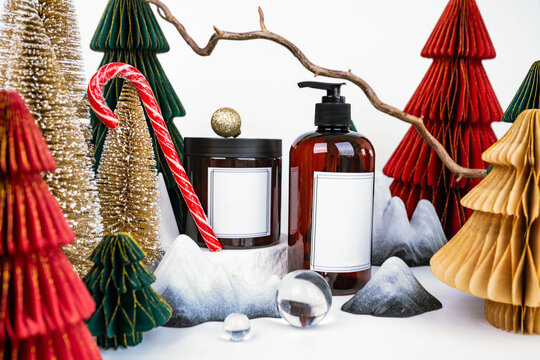 dark jar with lid and dispenser on the background of Christmas decorations, side view