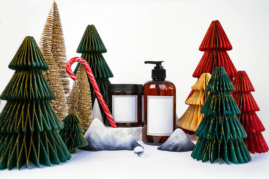 dark jar with lid and dispenser on the background of Christmas decorations, side view