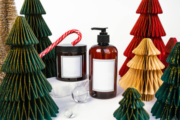 dark jar with lid and dispenser on the background of Christmas decorations, side view